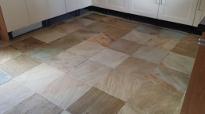 cleaned and sealed sandstone tiled kitchen floor